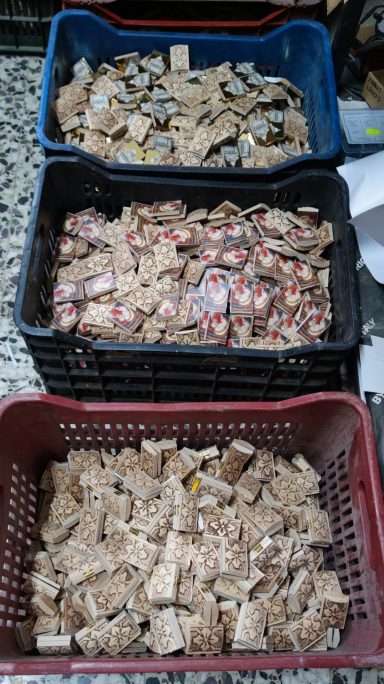 Mini Icon Pieces – Workshop Production Small wooden icon pieces after cutting, sorted in workshop crates